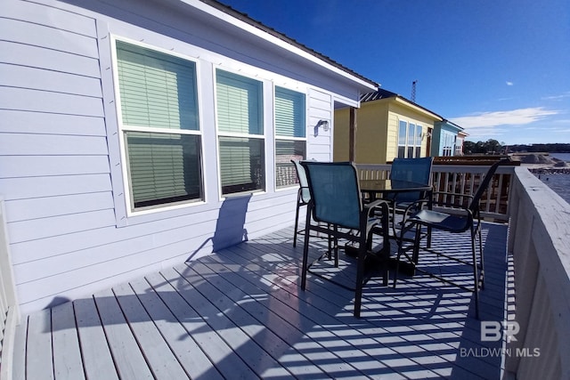 deck featuring outdoor dining area