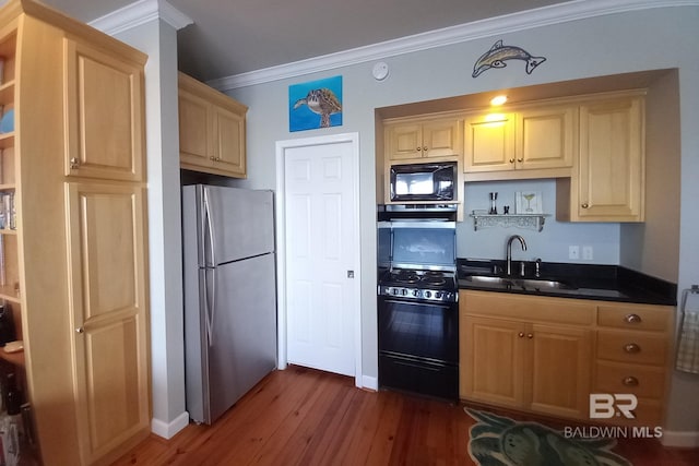 kitchen featuring open shelves, a sink, black appliances, dark countertops, and crown molding