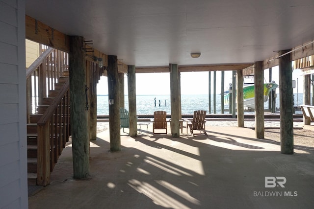 exterior space featuring a water view and stairs