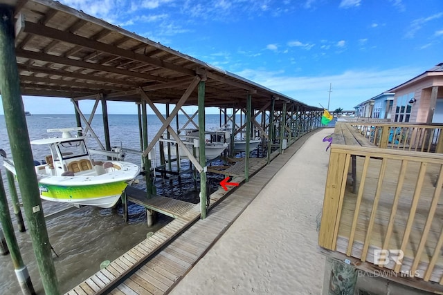 dock area featuring a water view and boat lift