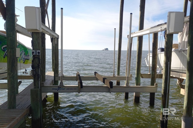 view of dock with a water view and boat lift