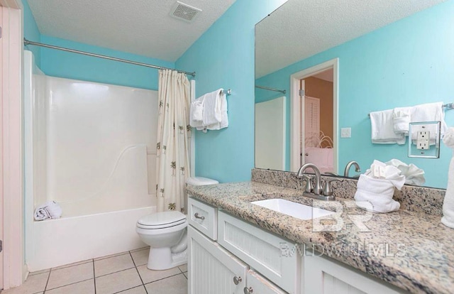 full bathroom with a textured ceiling, shower / tub combo, tile patterned floors, vanity, and toilet