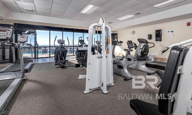 workout area with a paneled ceiling