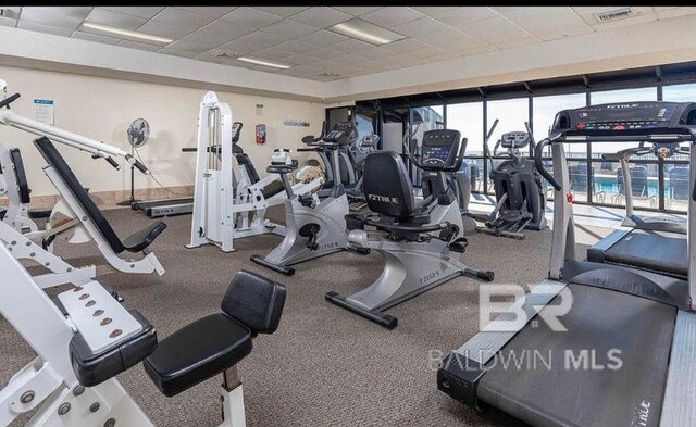 workout area featuring a paneled ceiling