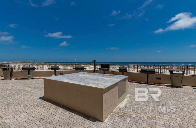 view of patio / terrace featuring a water view