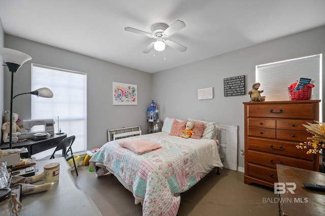 bedroom featuring concrete floors and a ceiling fan