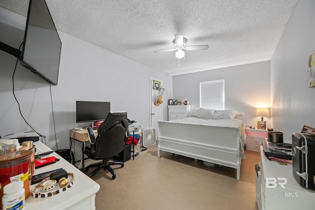 bedroom featuring finished concrete floors, ceiling fan, and a textured ceiling