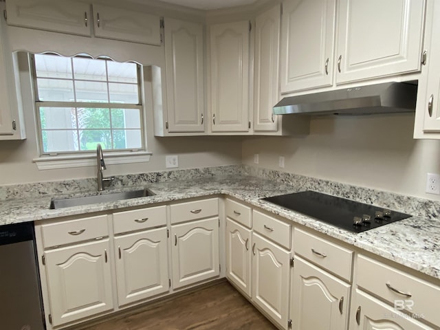 kitchen with stainless steel dishwasher, black electric cooktop, a sink, under cabinet range hood, and white cabinetry