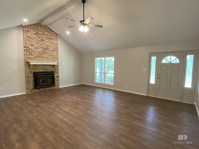 unfurnished living room with dark wood-style flooring, a ceiling fan, baseboards, and lofted ceiling with beams