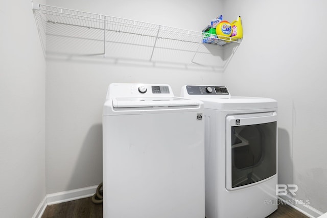 laundry area featuring dark hardwood / wood-style floors and independent washer and dryer