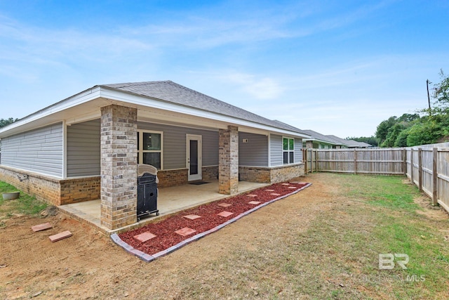 back of house with a patio area