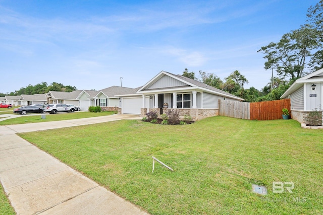 view of front facade with a garage and a front yard