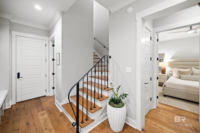 stairs with hardwood / wood-style flooring