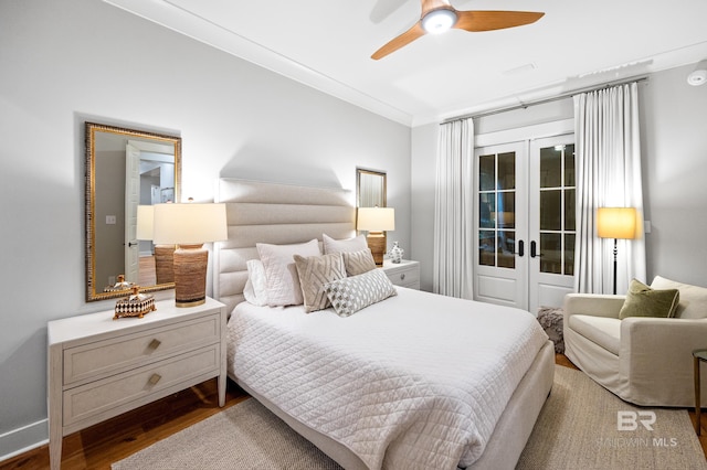 bedroom with french doors, dark hardwood / wood-style floors, ceiling fan, and crown molding