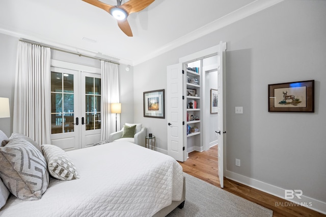 bedroom with wood-type flooring, french doors, ceiling fan, and ornamental molding