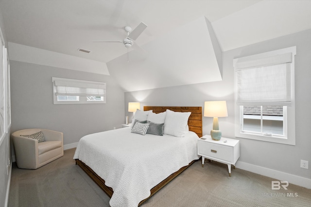 bedroom with ceiling fan, light colored carpet, and vaulted ceiling