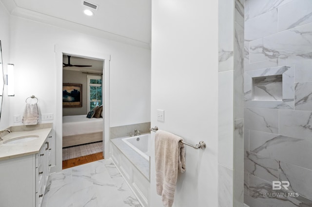 bathroom featuring vanity, crown molding, ceiling fan, and a tub