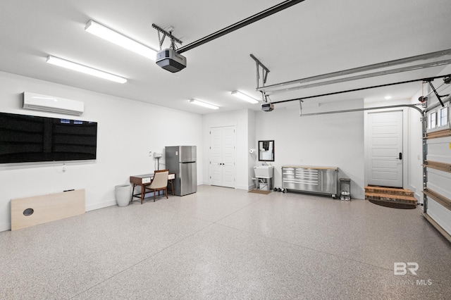 garage with a wall mounted air conditioner, stainless steel fridge, a garage door opener, and sink