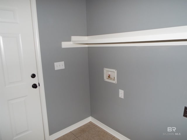 laundry room featuring washer hookup and light tile patterned floors