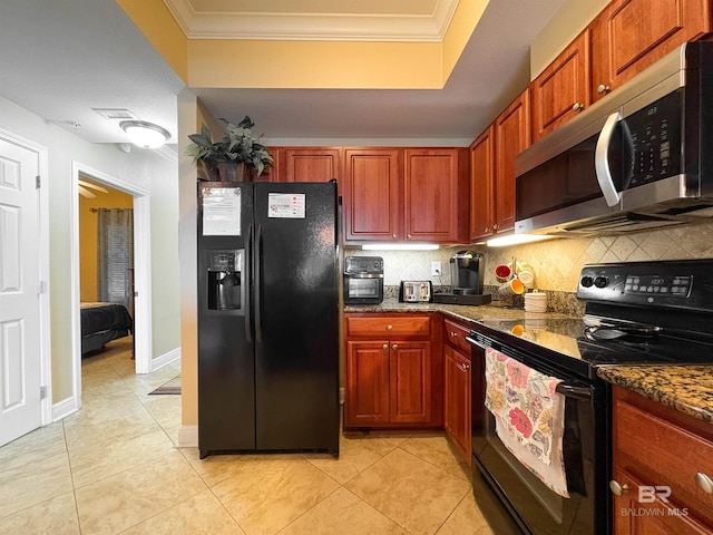 kitchen with crown molding, light tile patterned floors, backsplash, and black appliances