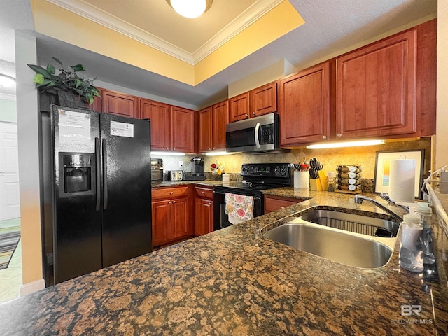kitchen featuring a sink, backsplash, black appliances, and ornamental molding