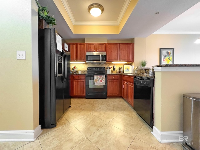 kitchen featuring a raised ceiling, a peninsula, crown molding, and black appliances