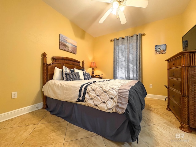 bedroom with baseboards, a ceiling fan, and light tile patterned floors