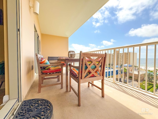 balcony featuring a water view