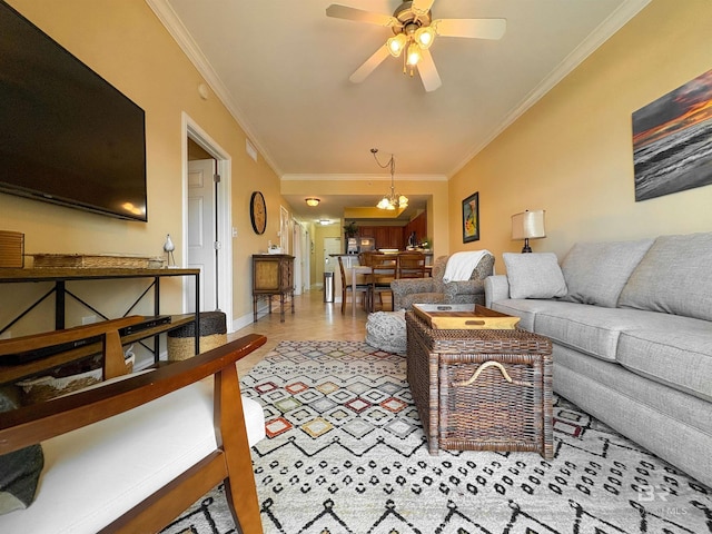 living room featuring baseboards, ornamental molding, and ceiling fan with notable chandelier