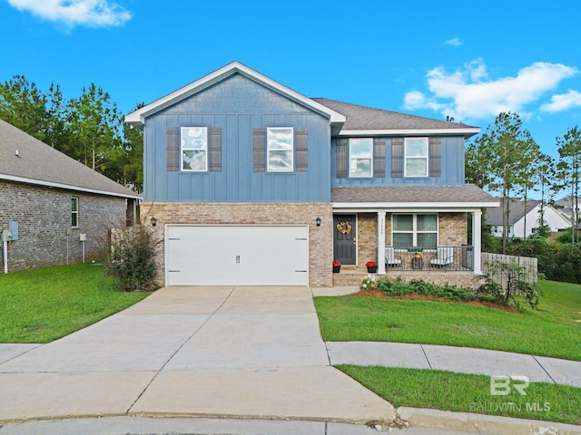 view of front of house with a garage, a porch, and a front lawn