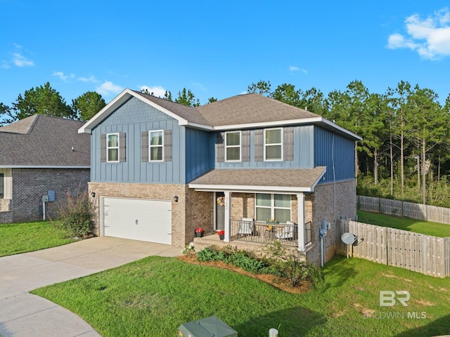 view of front of house with a front yard and a garage