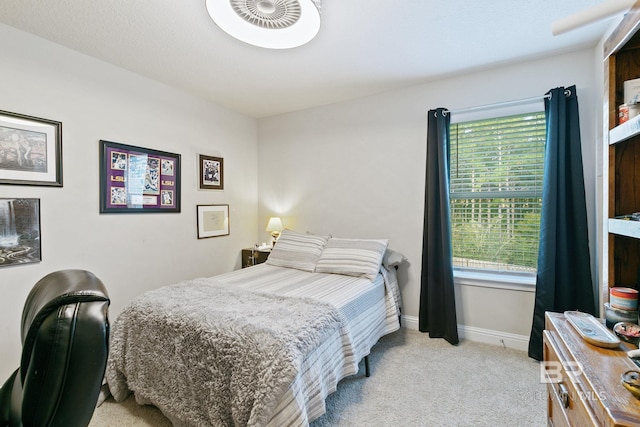 bedroom with light colored carpet