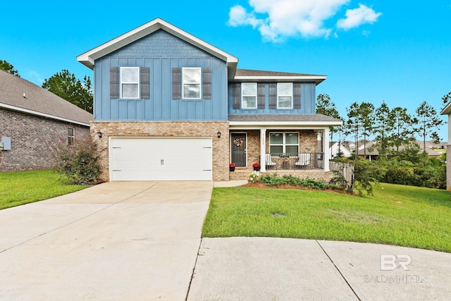 view of front of property featuring a garage, a porch, and a front lawn