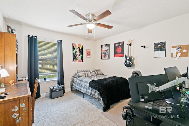 bedroom featuring light carpet and ceiling fan