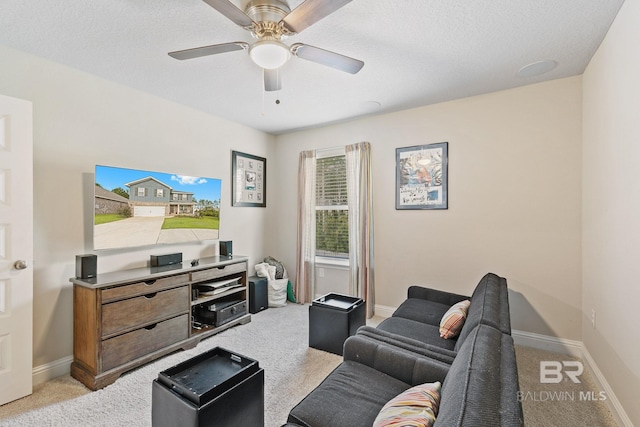 carpeted living room with ceiling fan and a textured ceiling