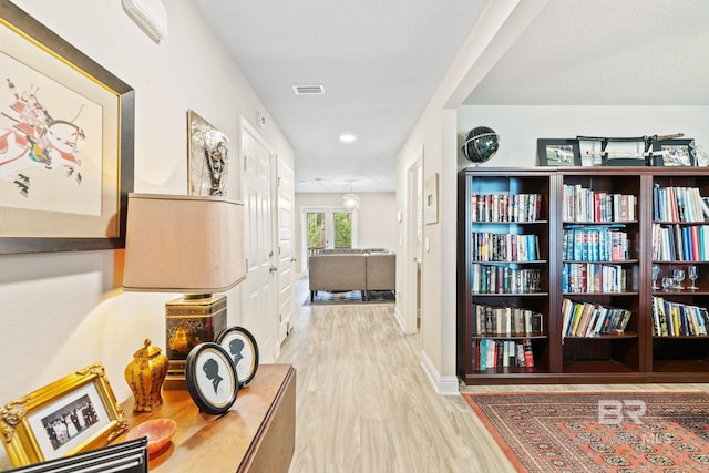 hall featuring wood-type flooring