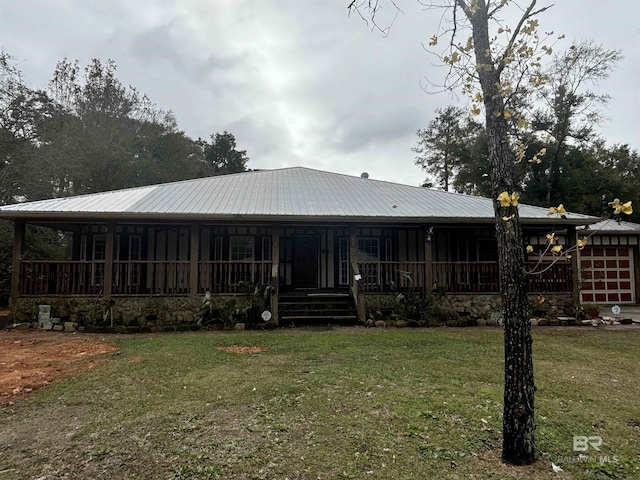 rear view of property with a lawn