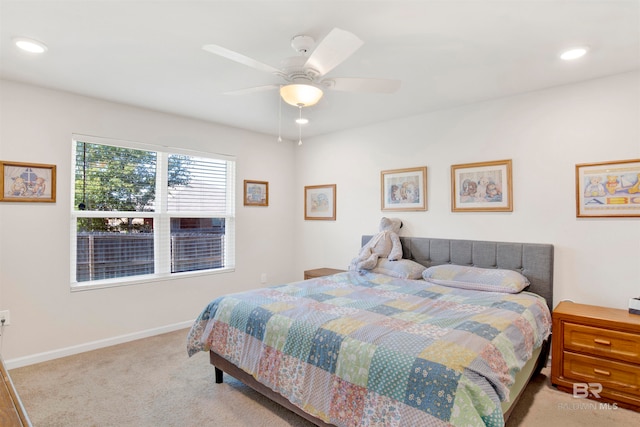 bedroom featuring ceiling fan and light colored carpet