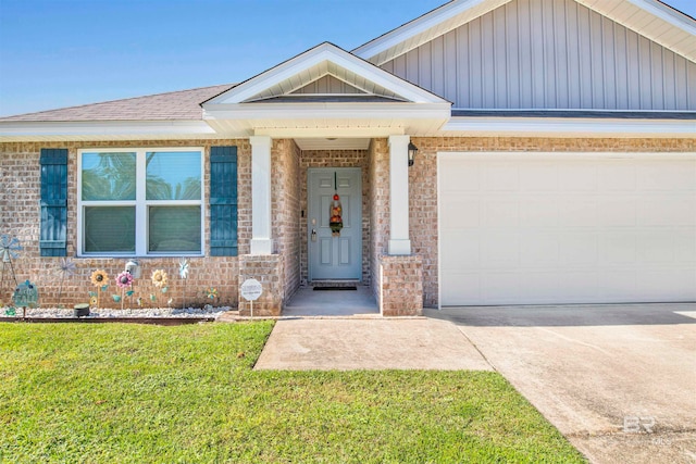 view of front of home with a garage and a front lawn