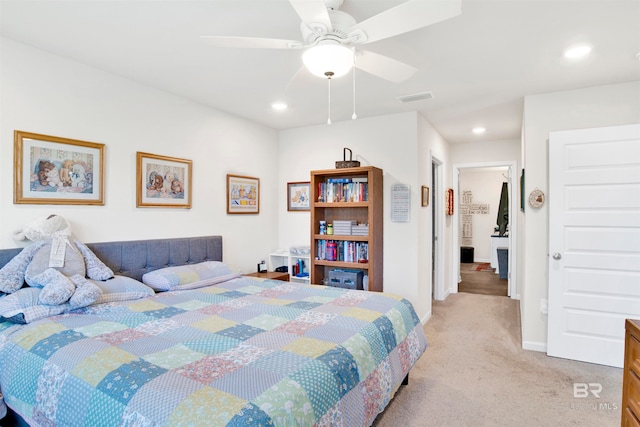 bedroom with ceiling fan and light carpet