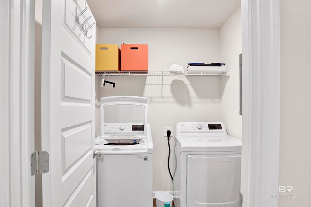 laundry area with washing machine and clothes dryer