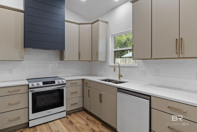 kitchen featuring a sink, light wood-style floors, ventilation hood, dishwasher, and stainless steel range with electric stovetop