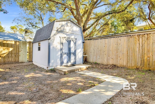 view of shed featuring a fenced backyard