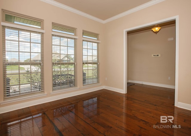 unfurnished room with ornamental molding and dark hardwood / wood-style floors