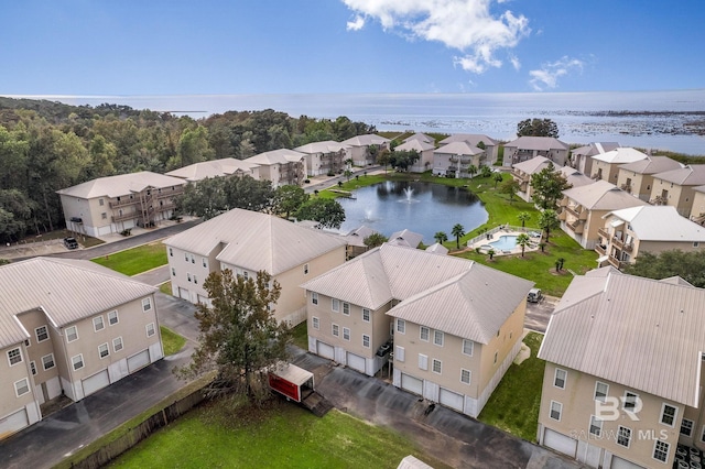 bird's eye view featuring a water view and a residential view