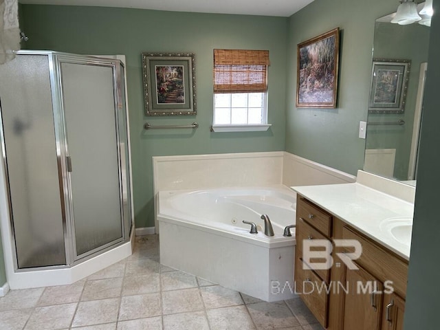 bathroom featuring a stall shower, a jetted tub, and vanity