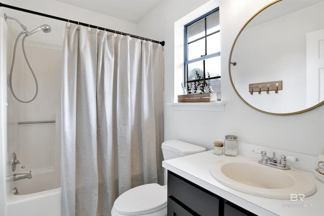 bathroom featuring shower / bath combo with shower curtain, toilet, and vanity