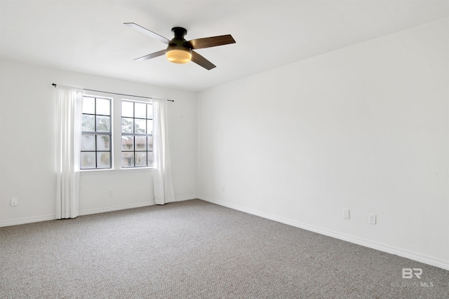 unfurnished room featuring baseboards, ceiling fan, and carpet floors