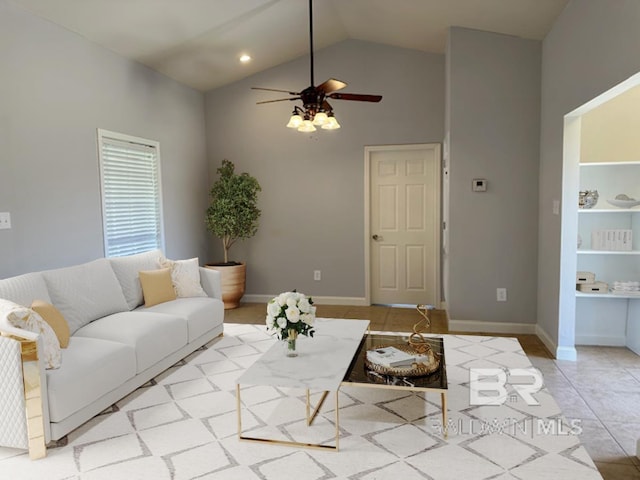 16825 Edward Dr, Gulf Shores, AL 36542 - living area with a ceiling fan, high vaulted ceiling, light tile patterned flooring, and baseboards