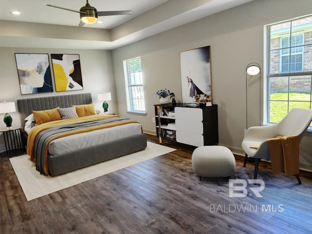 16825 Edward Dr, Gulf Shores, AL 36542 - bedroom featuring wood finished floors, multiple windows, baseboards, and recessed lighting